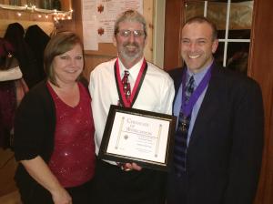 Eliza and Al Duaime receive the Family of the Year award from Grand Knight Ray Iacovone. 