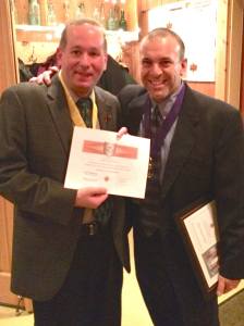 Chaplain of the Year, Deacon Kevin Heil receives his Shining Armor Award from Grand Knight Ray Iacovone.